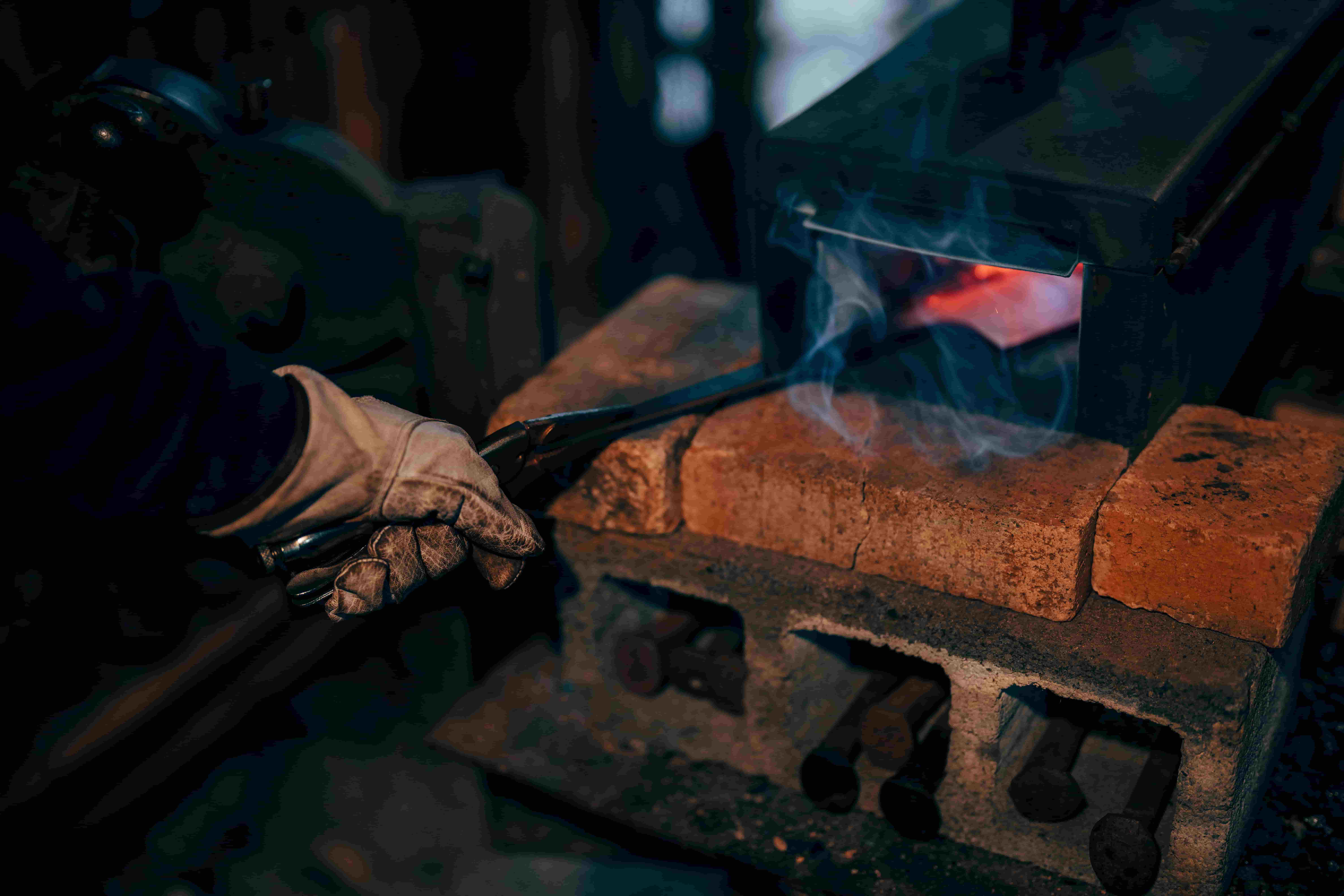 Steel in forge with smoke