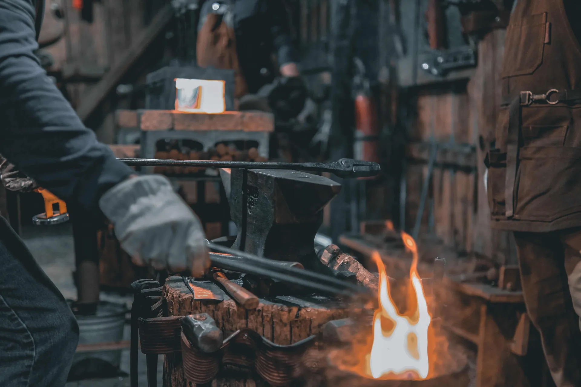 Smith with tongs and steam